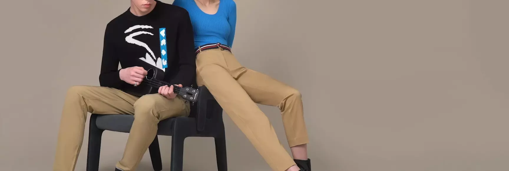 A young couple models woven pants powered by the 360o comfort and fit of LYCRA® XFIT technology.